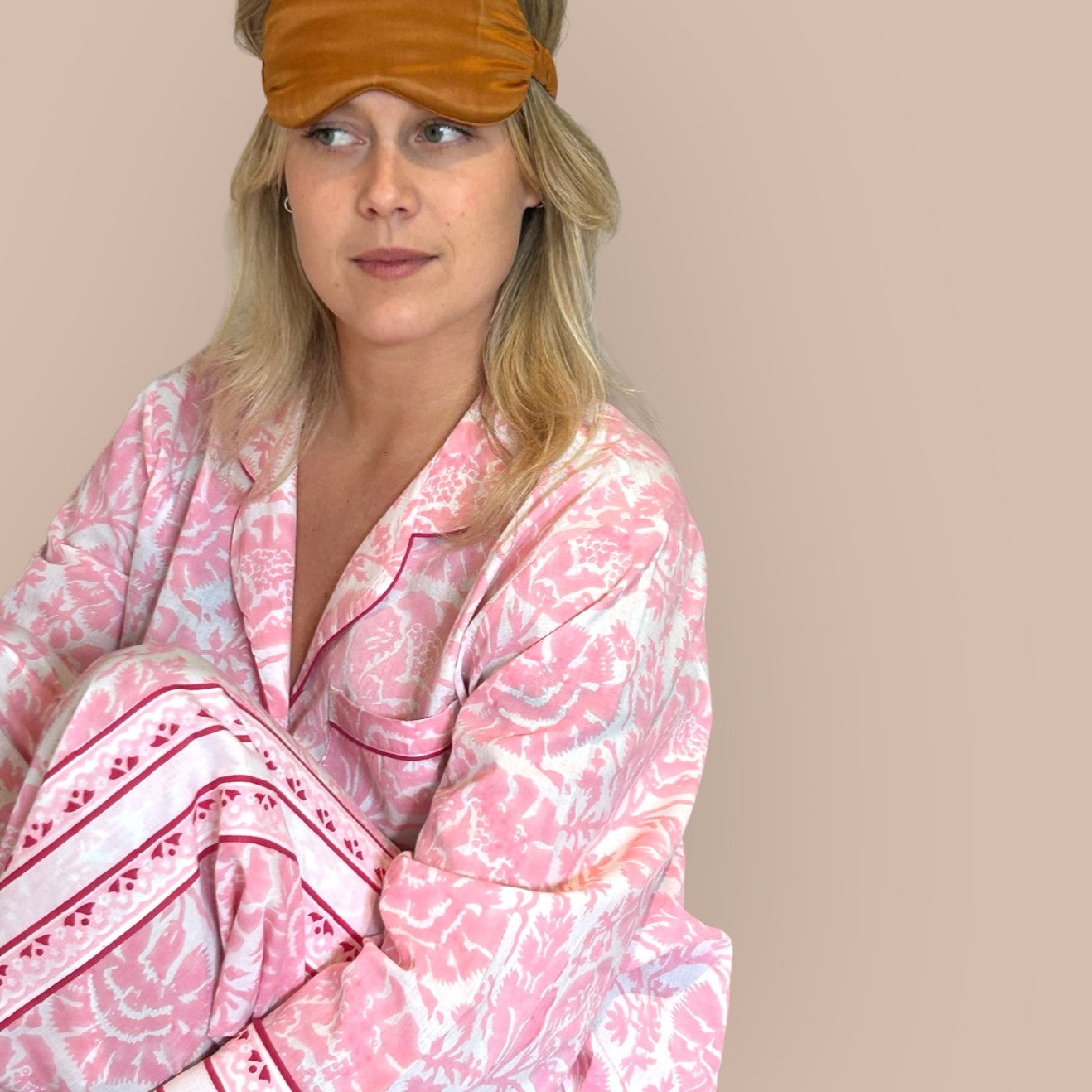 Women's pyjama sets in cool, breathable cotton long pyjamas in pink and white. Stripes down the side of the leg and sleeve detail. Block printed in India